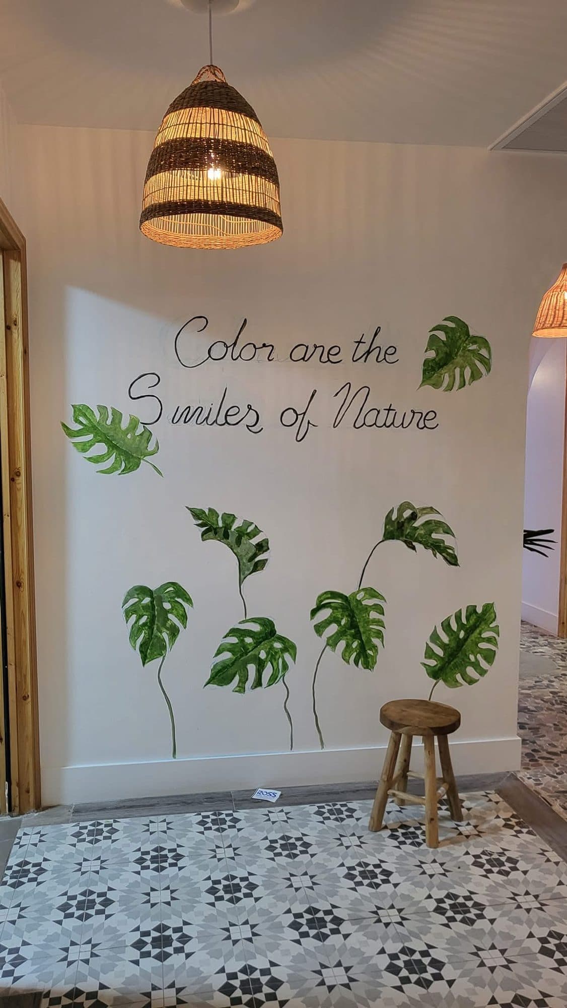 Monstera leaves with the hand-lettered phrase Colors are the smiles of nature