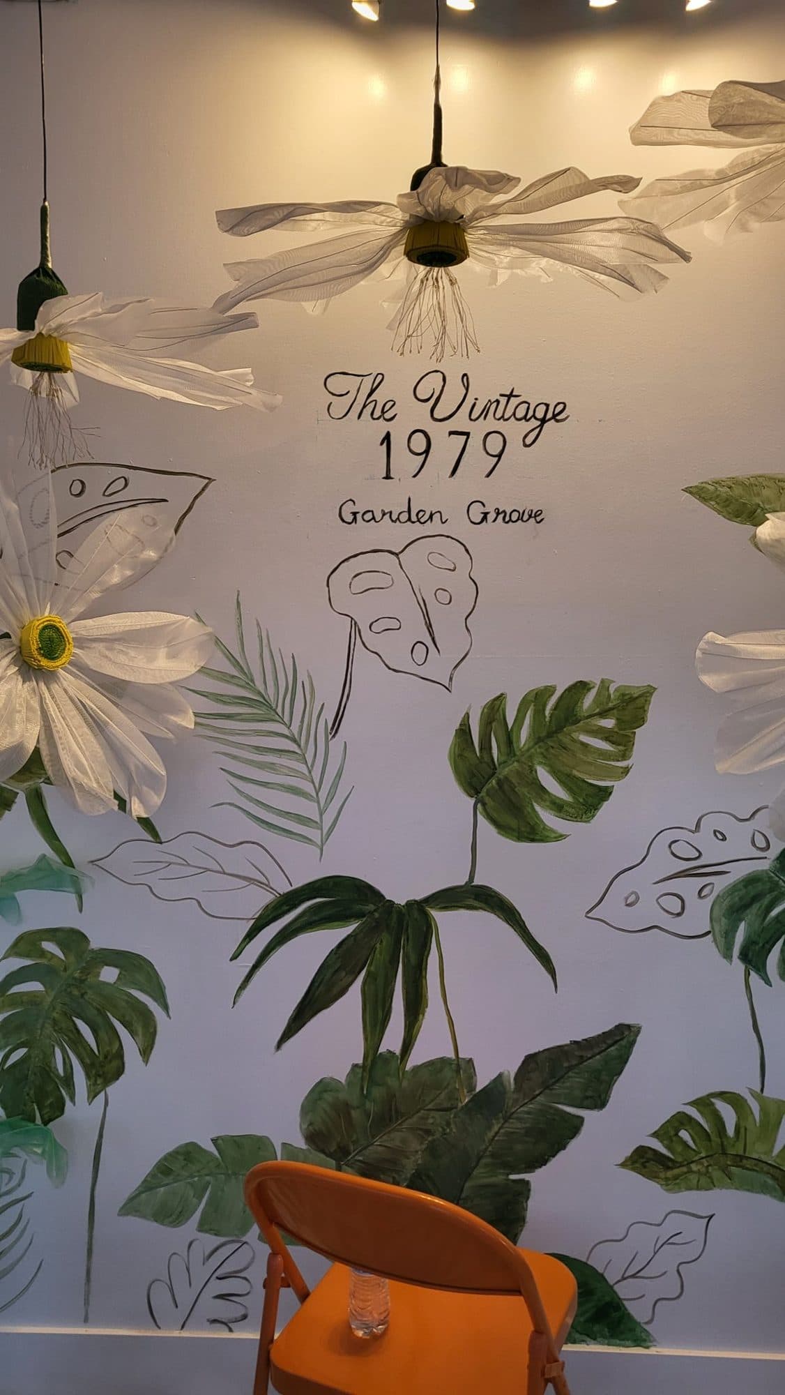 The Vintage 1979 Garden Grove name lettered among painted leaves
